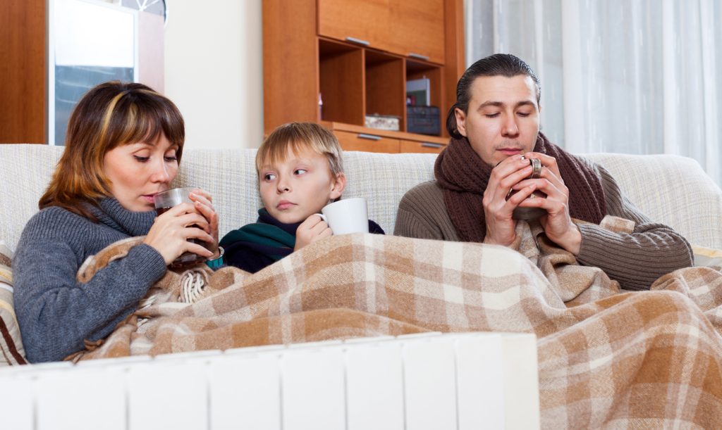 family warming with cups of tea